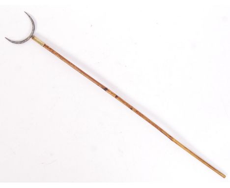 An antique 19th century bamboo Chinese hunting arrow with curved spike to end. Measures approx 51cm long.&nbsp;