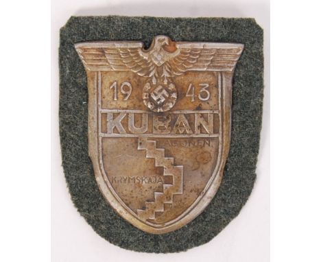 A 20th century Nazi German Third Reich ' Kuban 1943 ' metal plaque / patch. Laid onto fabric.   NOTE: From a private collecti