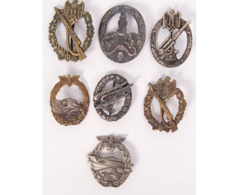 A collection of 7x presumed reproduction WWII Second World War Nazi German Third Reich uniform badges / awards to include; E 