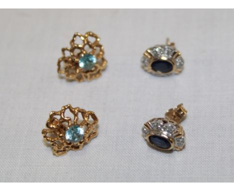 A pair of 9ct gold rustic earrings set topaz and one other pair of sapphire mounted earrings (4)