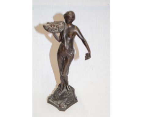 A good quality bronze figure of a classical female holding a basket of fruit, signed "Henn", 7½" high