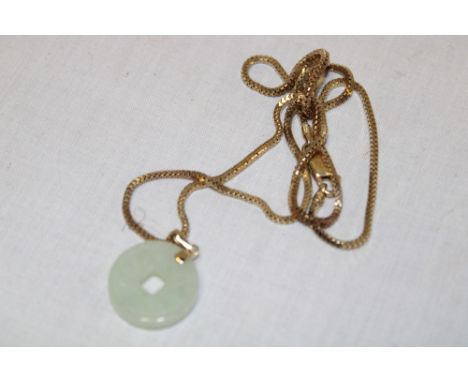 A silver gilt pendant necklace set a jade panel 