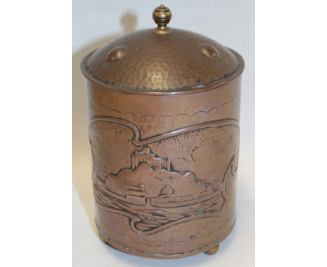 A rare Newlyn copper cylindrical biscuit jar and cover decorated in relief with St Michael's Mount, signed H Dyer, 6½" high 