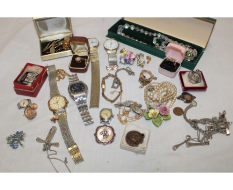 A quantity of various costume jewellery including brooches, wristwatches, necklaces etc 