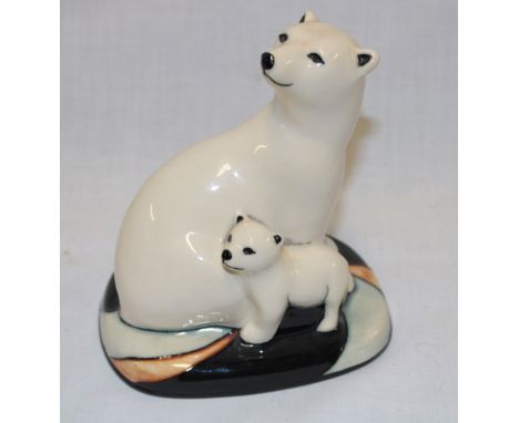 A Moorcroft pottery figure of a polar bear with cub dated 2009 5" high 