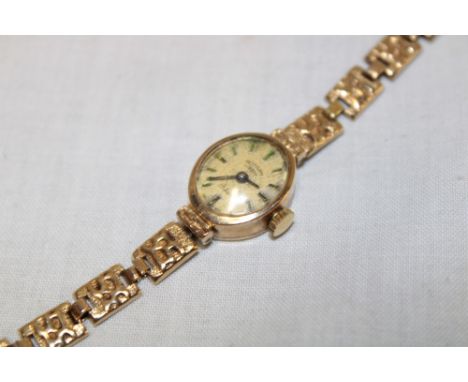 A ladies 9ct gold wristwatch by Rotary with 9ct gold strap (12.3g gross)