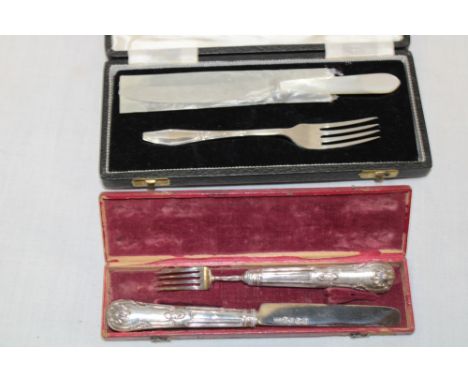 A George IV silver knife and fork with kings pattern handles in Morocco leather case, Birmingham marks 1827 together with one