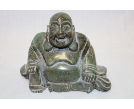 An Eastern carved jade Buddha figure 5½" long