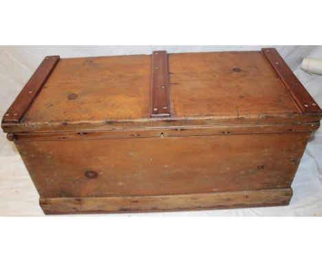 A 19th century polished pine rectangular trunk with hinged lid, 35" long 