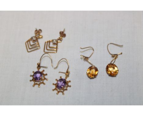 Four pairs of 9ct gold earrings including citrine mounted earrings, amethyst earrings etc  