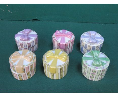 SIX VARIOUS "A MOTHERS LOVE" CERAMIC HAT BOX FORM MUSIC BOXES