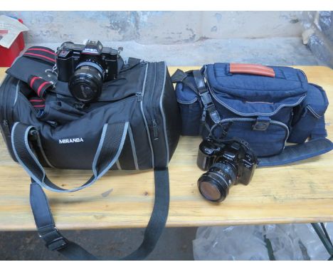 TWO MINOLTA CAMERAS WITH BAGS 