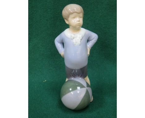 ROYAL COPENHAGEN GLAZED CERAMIC OF A BOY WITH A BEACH BALL, NUMBER 3542.  APPROXIMATELY 18cm HIGH