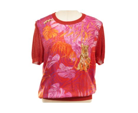 A SALVATORE FERRAGAMO FUCHSIA AND RED TIGER PRINT BLOUSE
Silk and knitted short sleeve blouse with tiger and foliate print to