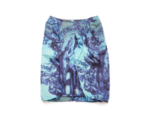 A PRADA BLUE LANDSCAPE PRINT SILK SKIRT
With pleated details to the front, with original swing tags attached
Prada
Size FR 44