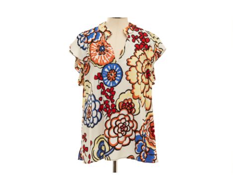 A LOUIS VUITTON FLORAL PRINT BLOUSE
Cream and multicoloured floral printed blouse, with a deep V neckline and ruffle sleeves
