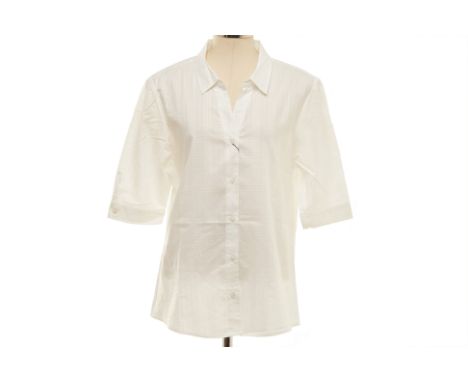 A BURBERRY WHITE SHIRT
Short sleeved cotton button-up shirt with checked texture to the fabric and a deep V neckline, with ad