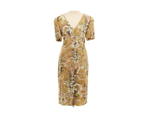 A DOLCE &amp; GABBANA OLIVE GREEN FLORAL PRINT DRESS
Three-quarter length short sleeved V neck floral dress, with zip closure