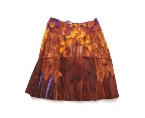 A PRADA FEATHER PRINT SILK SKIRT
Knee length pleated silk skirt with brown feather motifs, with side popper enclosure, with o