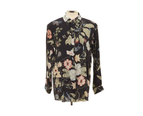 A GUCCI FLORAL PRINT SILK SHIRT
Black button-up long sleeved silk shirt with floral and butterfly motifs
Gucci
Size IT 46
Con