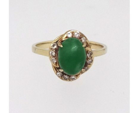 A 14ct jade and diamond cluster ring, finger size K.