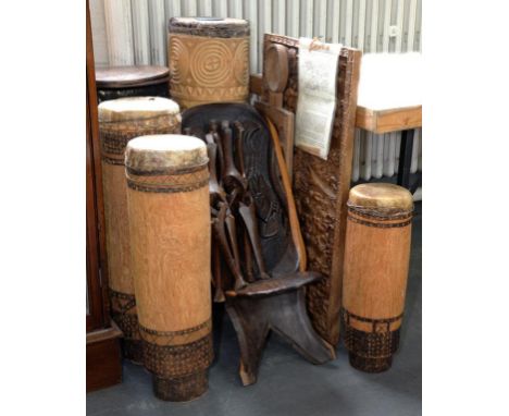TRIBAL ART.  AN AFRICAN CARVED WOOD PANEL OF THE MOUNTAIN OF CREATION, 52CM X 92CM, THREE OTHER ITEMS, INCLUDING A CHAIR AND 