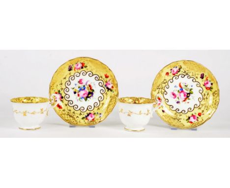 A PAIR OF COALPORT YELLOW GROUND FLORAL PAINTED COFFEE CUPS AND SAUCERS, PATTERN 2/496, c 1830