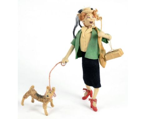 AN UNUSUAL 1930'S FELT DOLL OR FIGURE OF A LADY WITH A LORGNETTE AND DOG, 24CM H