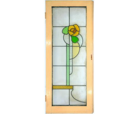 A 1930'S ART DECO LEADED GLASS WINDOW LIGHT SET IN A PAINTED WOOD CUPBOARD DOOR, 120CM H 