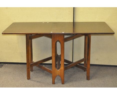 A 20th century mahogany drop leaf table, with pierced supports and rounded edges, 74cm x 144cm x 83cm (opened) Condition Repo