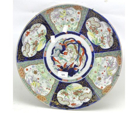 A 20th century ceramic charger, of circular form, decorated with a central cartouche featuring a bird, surrounded by six addi