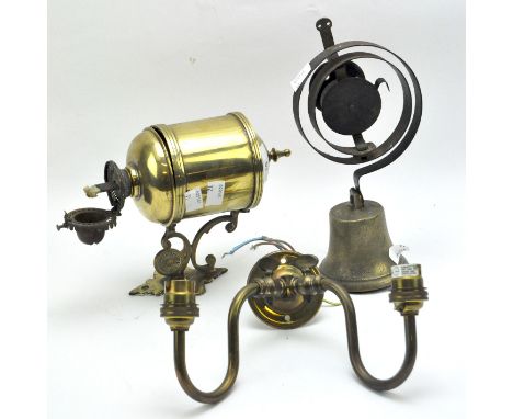 Two brass wall bracket light fixtures and a bell, one of the brackets in the form of an oil lamp, the other an electric examp