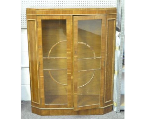 An Art deco display cabinet, the vaneered case with glazed doors and side panels, 128cm x 100cm x 33cm Condition Report: Top 