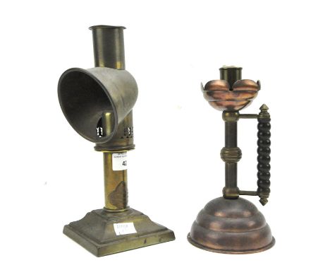 Two reading lamp candles, one a brass example by A. Barrett &amp; Sons mounted on a square base, the other in copper and with