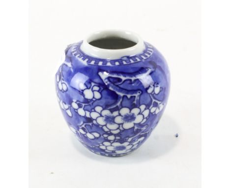 A Chinese blue and white ceramic ginger jar, with cherry blossom decoration, lacking lid, 10cm high