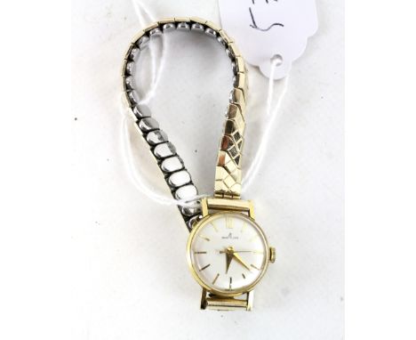 A vintage ladies Breitling cocktail watch, silvered dial with gilt baton hour markers and 12 noon in Arabic, on expanding str