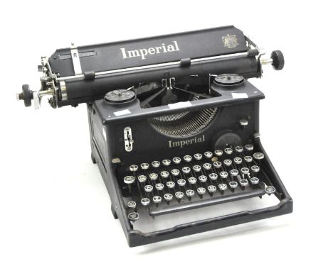 An Imperial typewriter, in black with the Royal coat of arms decal to the front, the typewriter having responsive keys, margi