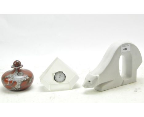 Three table items including a Porceval Valencia polar bear, height 13.5cm, an Island Studio Glass of Guernsey perfume bottle,