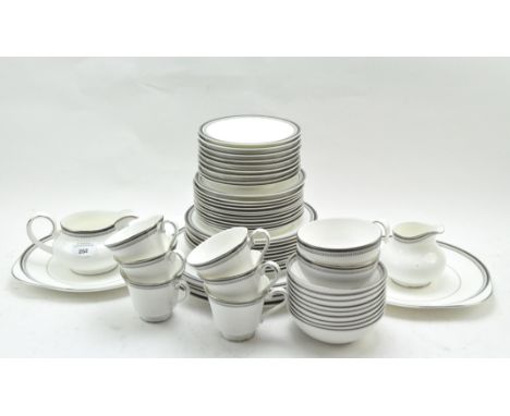 A Royal Doulton part tea service, in the 'Sarabande' pattern, H5023, including cups and saucers, plates, bowls and jugs