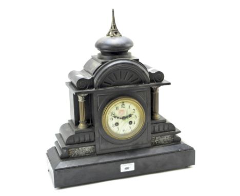 A large late 19th/early 20th century slate mantle clock, the enamel dial with Arabic numerals denoting hours, 44cm high