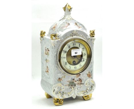 Early 20th century continental mantle clock, the ceramic and gilt dial with Arabic numerals, within a ceramic case decorated 