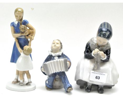Two Royal Copenhagen ceramic figures and one other, the Copenhagen figures marked 3667 and 1314 and modelled as a clown and a