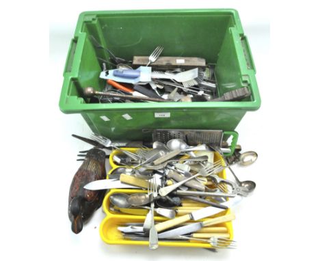 A large collection of flatware and tools, including knives, forks, graters, a whisk and more, some silver plated examples and