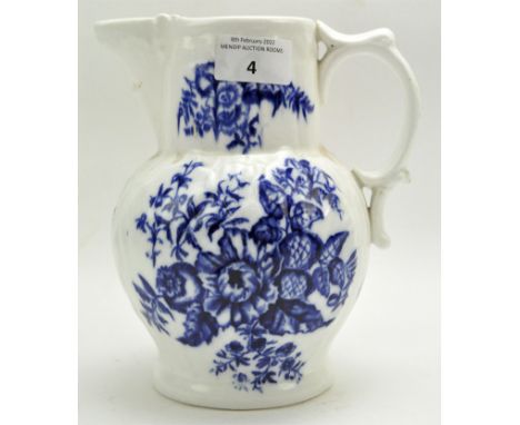 An 18th century Royal Worcester jug, glazed in white with blue floral decoration, height 19cm Condition Report: Large hairlin