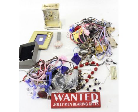 A quantity of costume jewellery, including a silver pendant, necklaces, bracelets, a watch and a carriage clock