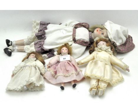 Four 20th century dolls, all with ceramic heads, dressed in traditional attire, height (of largest) 48cm Condition Report: on