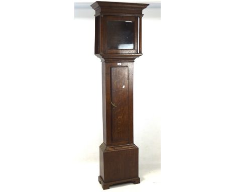 A Victorian longcase clock case, the wooden structure featuring a hood flanked with columns and a pediment base, lacking move