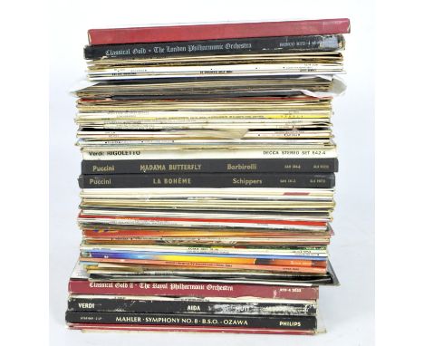 A collection of vinyl records, featuring a variety of music including Elvis Presley, Monty Python and more, in the original s