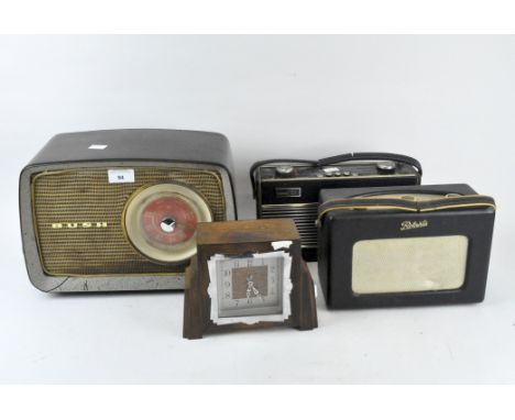 Three vintage radios and a mantle clock, comprising of two Roberts examples with carry handles to the top and a Bush radio wi