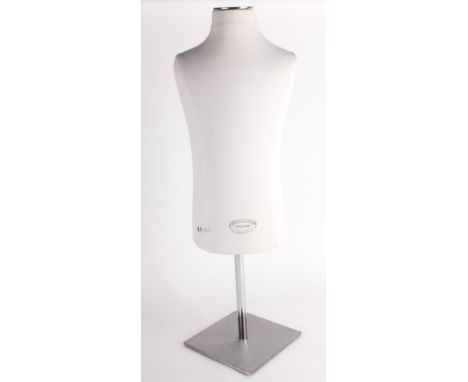 A small child-sized vintage style mannequin, made in France, with a fabric covered body on an adjustable metal stand.